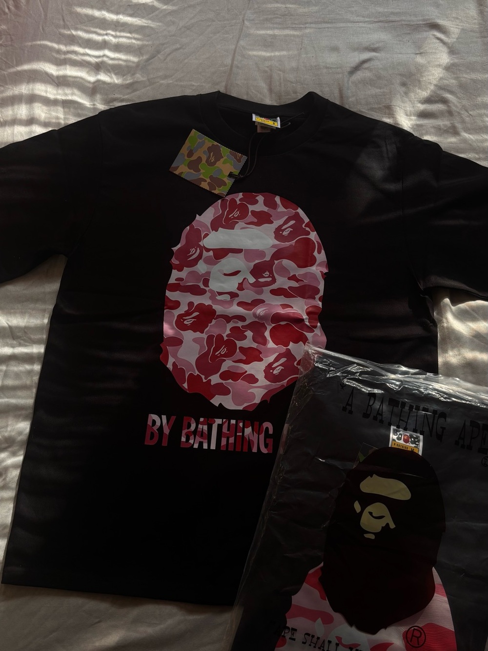 A Bathing Ape Black Short Sleeve Tee with Pink Camo Ape Graphic